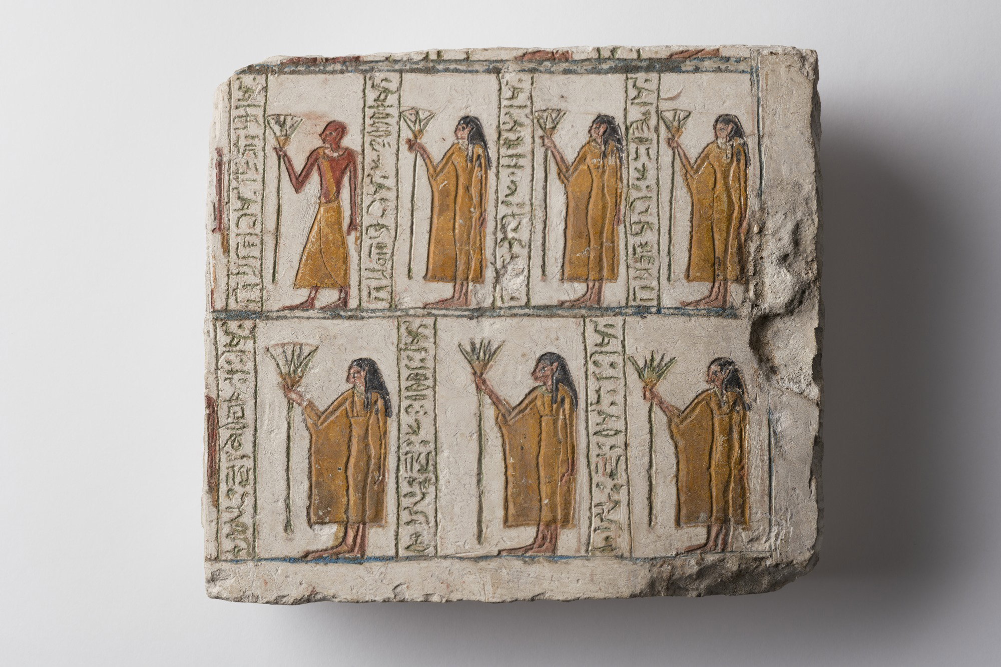 Fragment of Stela with Figures Holding Lotuses