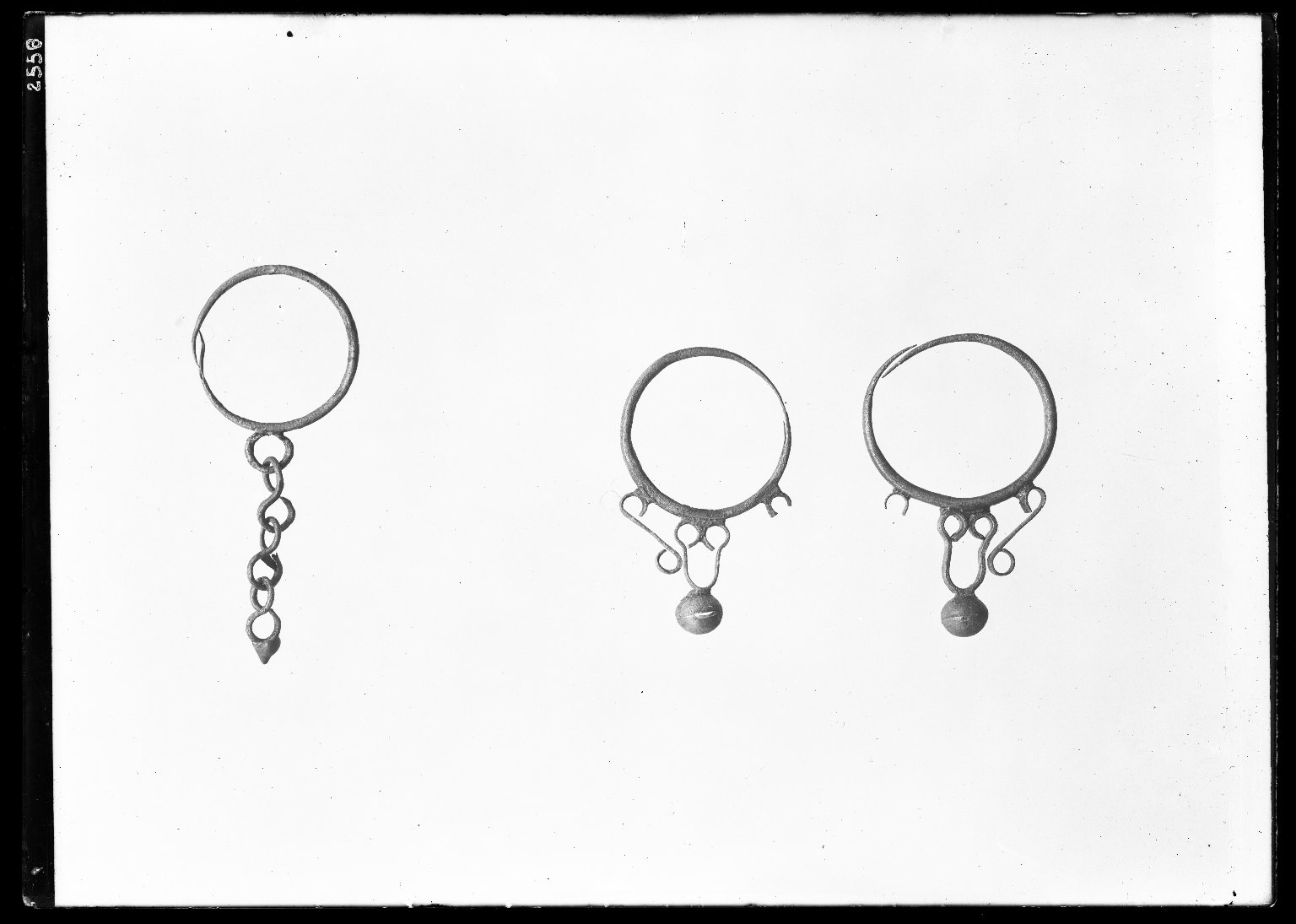 Earring with Large Circular Loop which Decends a Chain