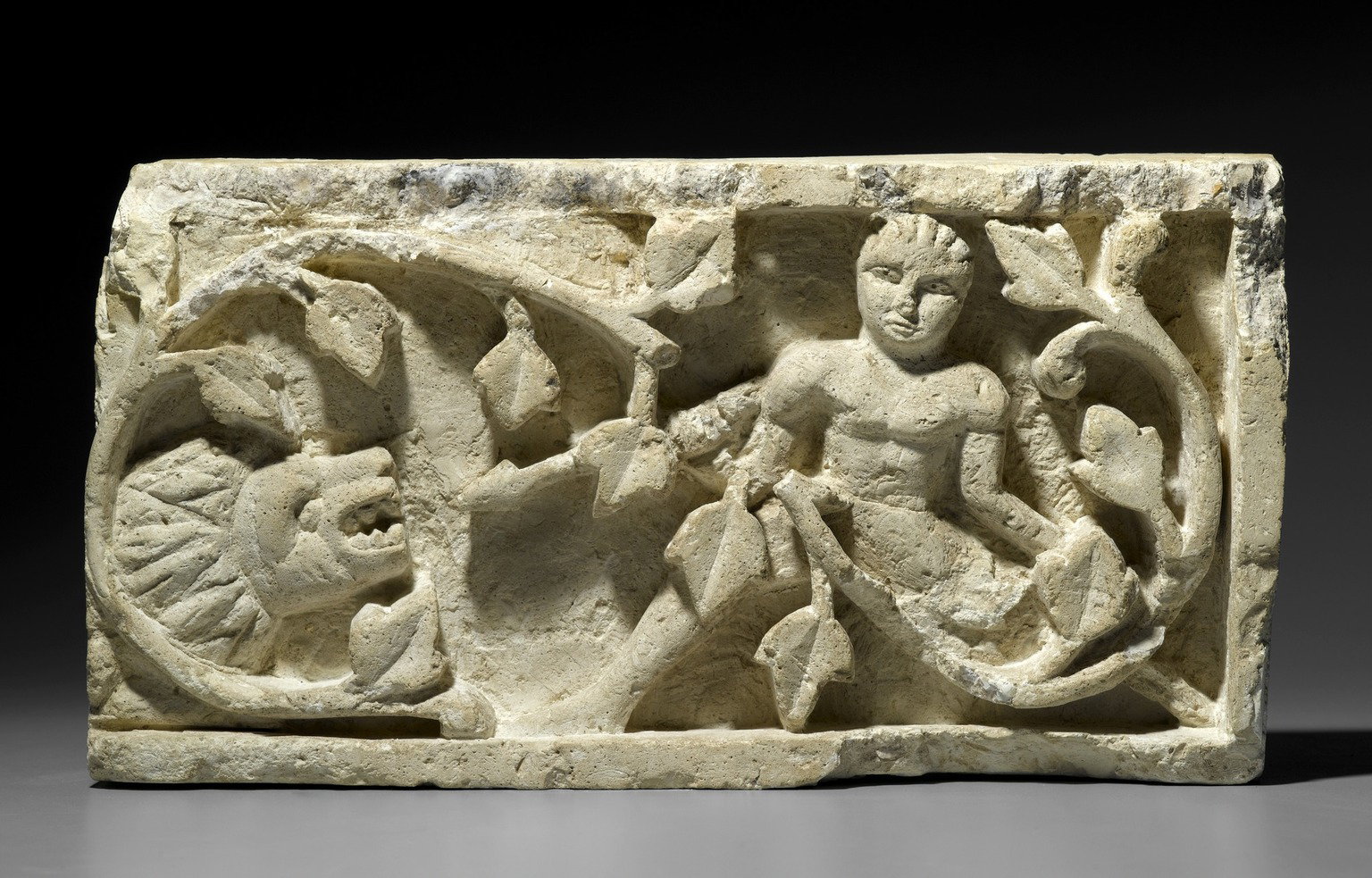 Recarved Plant Scroll with Human Figure and Lion Head