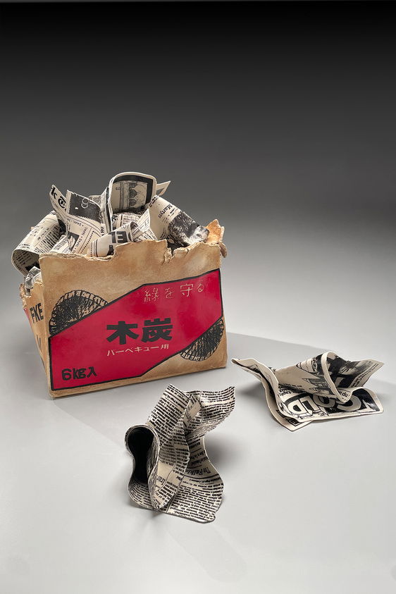Sculpture of charcoal box filled with newspaper · Brooklyn Museum