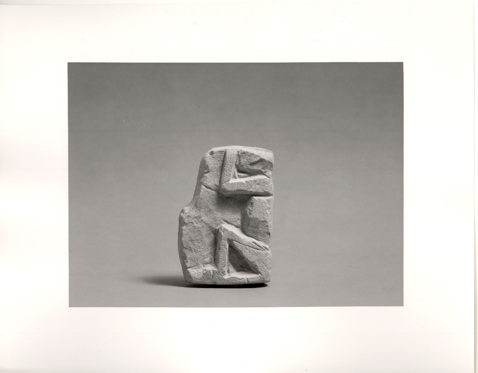 Small Monkey in Sitting Position with Upraised Arms