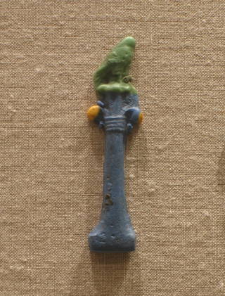 Falcon on a Column with Palm Capital
