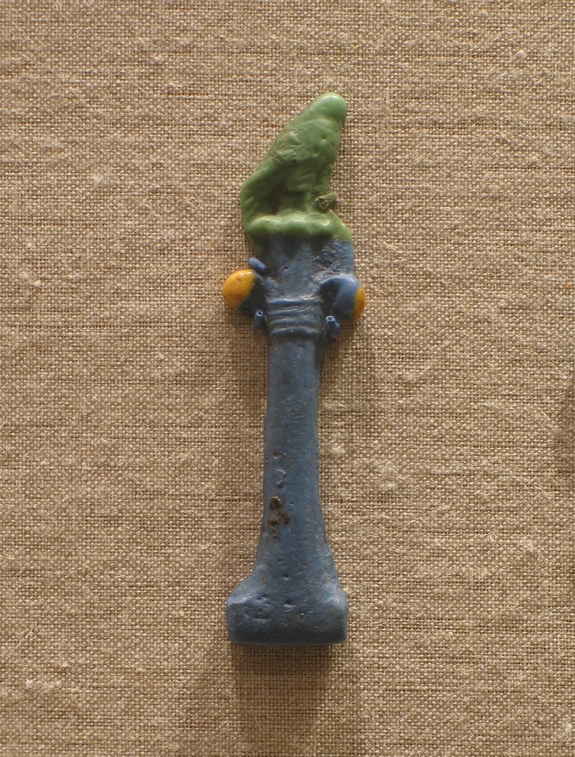 Falcon on a Column with Palm Capital