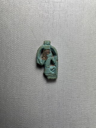 Amulet of the Deity Heh Holding Signs for Millions of Years