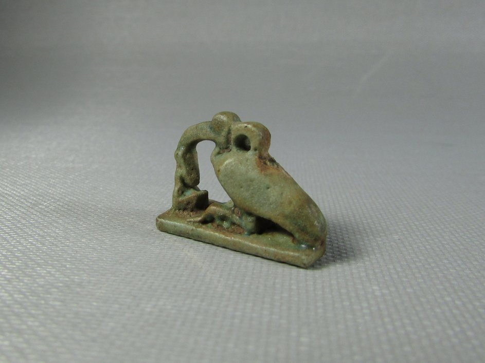 Human Before an Ibis Amulet