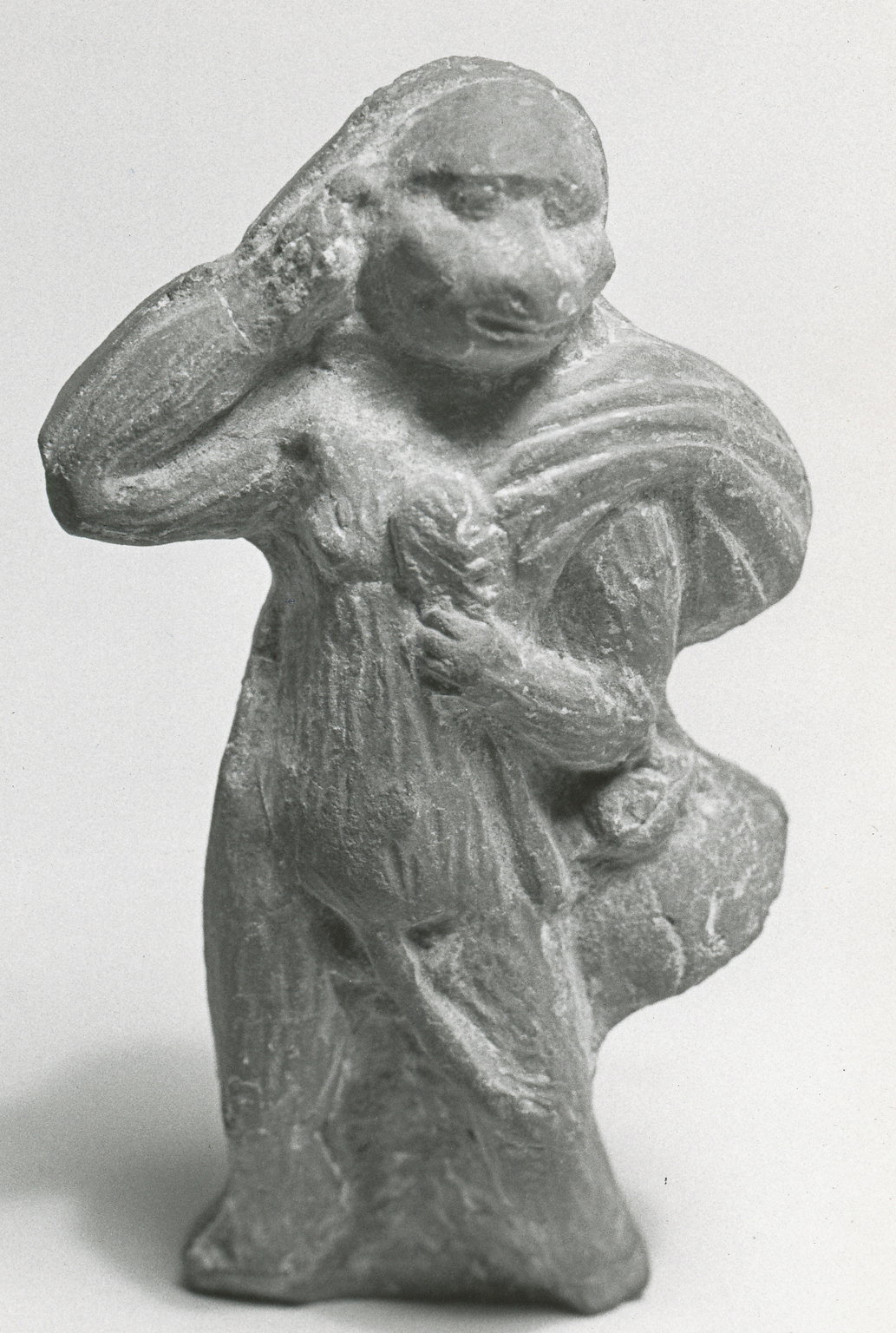 Figure of a Monkey Holding Sack Over His Shoulder