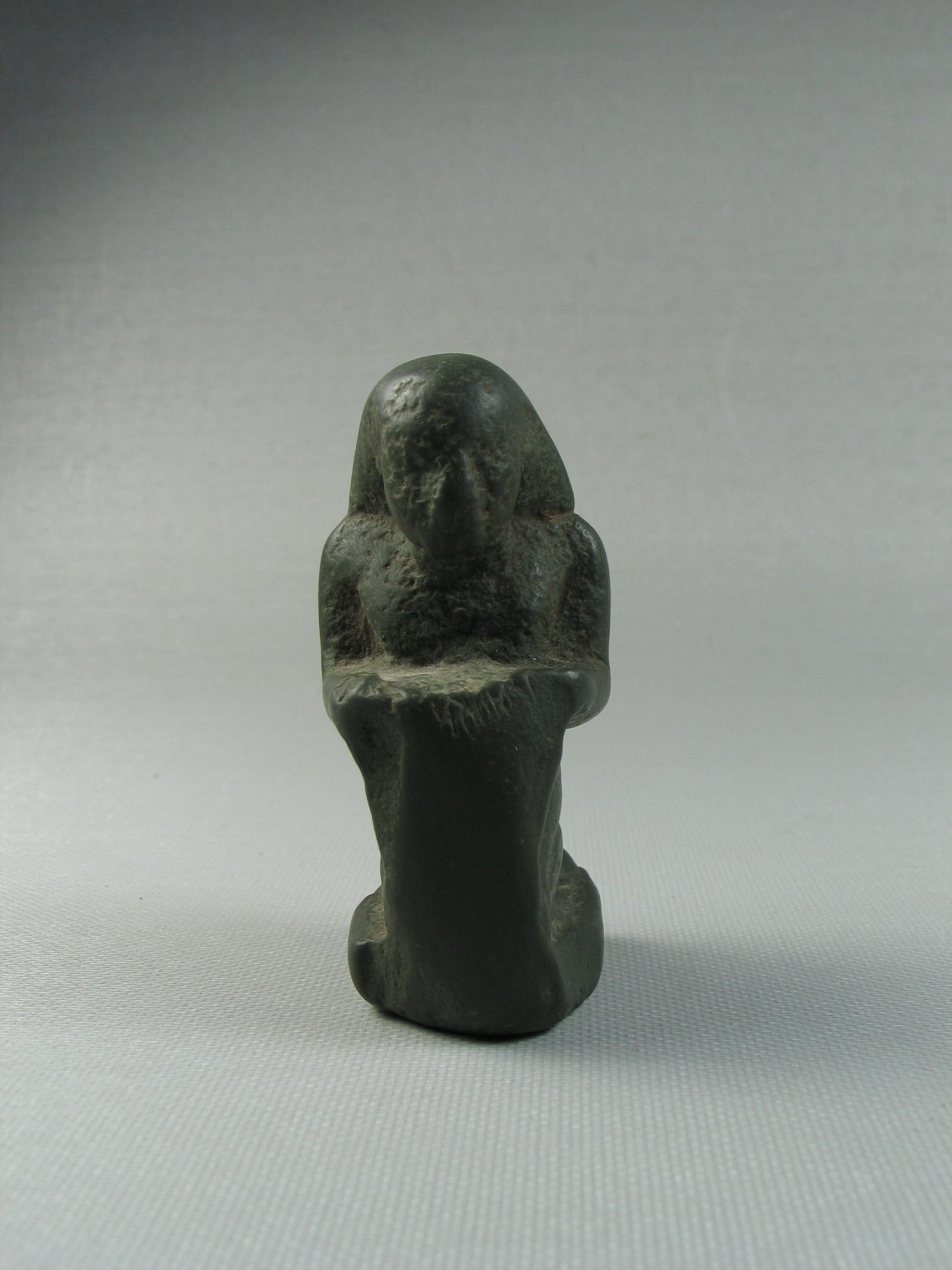Small Figure of a Man Kneeling and Holding Tablet Before Him
