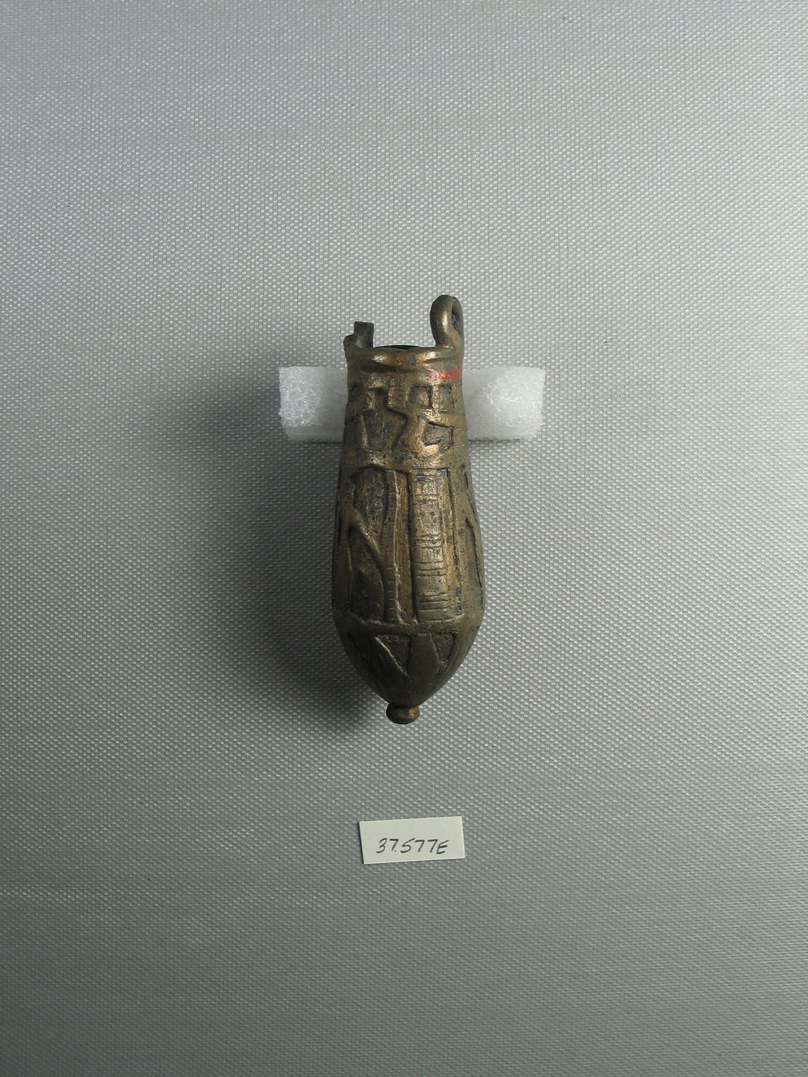 Situla Decorated with Crudely Cut Images of Dieties
