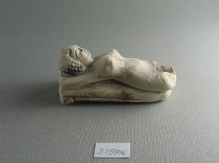 Small Figure of a Woman Lying on a Couch
