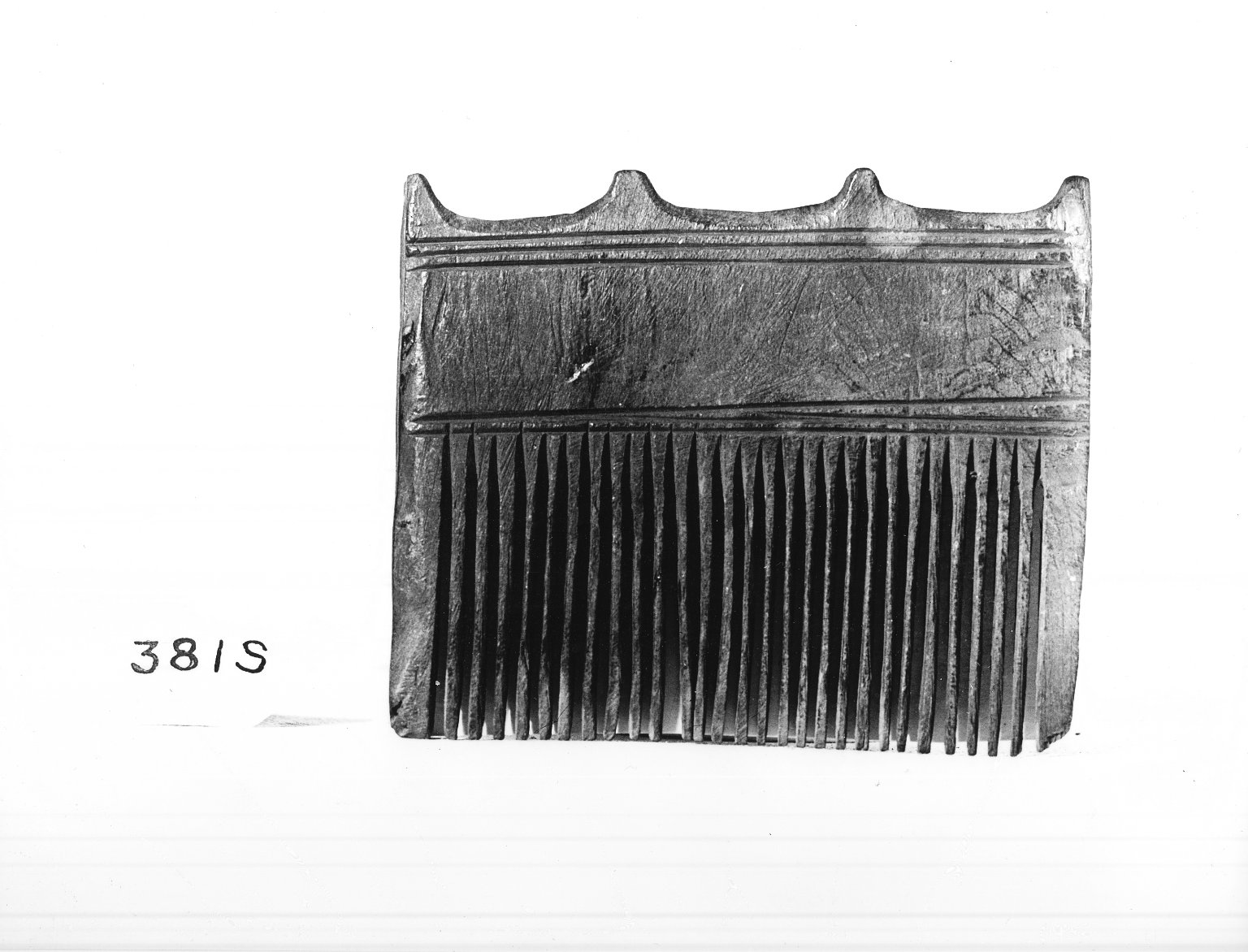 Comb Surmounted by Four Knobs