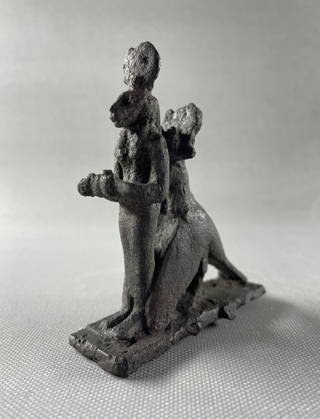 Group of the Goddess Sekhmet Standing Surmounted by the Sun Disk within the Embrace of a Jackal - Headed Bird