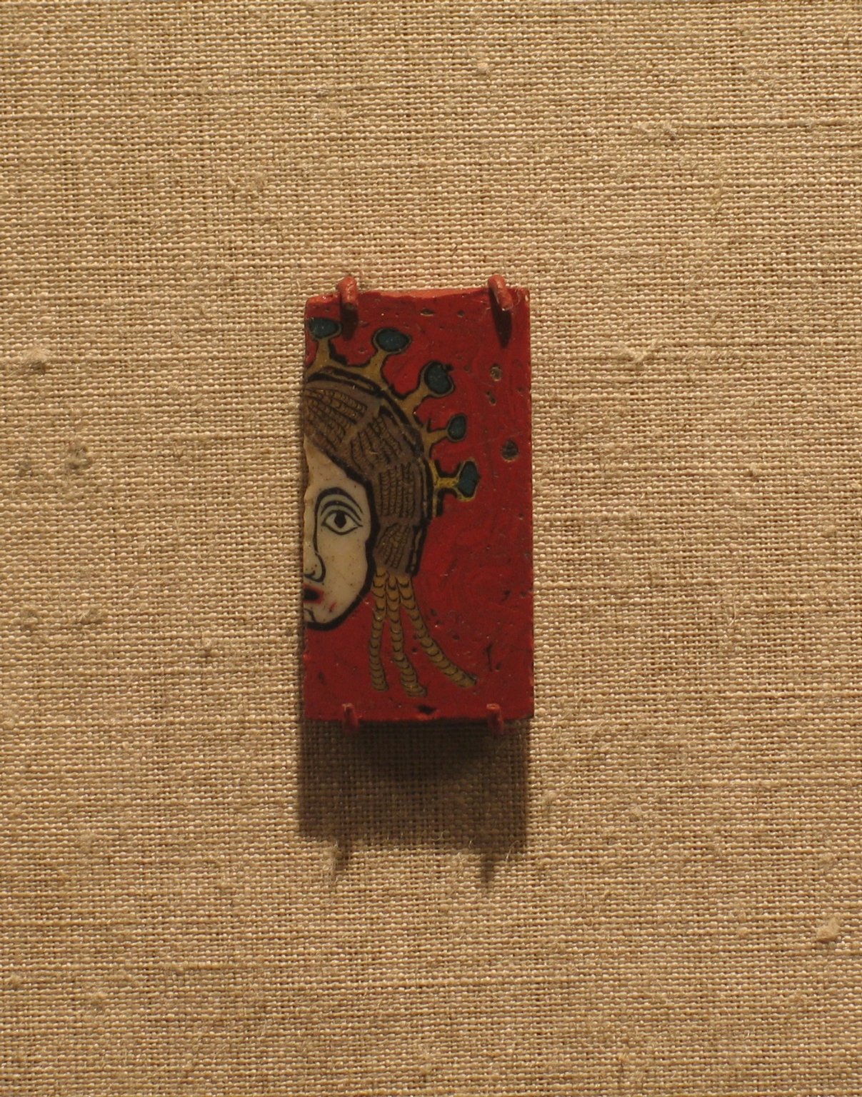 Plaque with Half of a Female Head